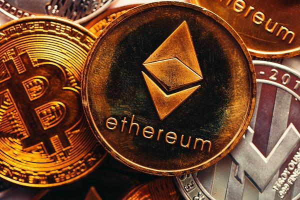 Close-up of stacked gold Bitcoin, Ethereum, and silver coins
